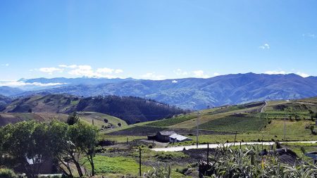 a view of mountains and fields in Ecuador