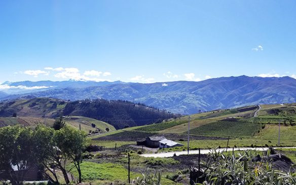 a view of mountains and fields in Ecuador