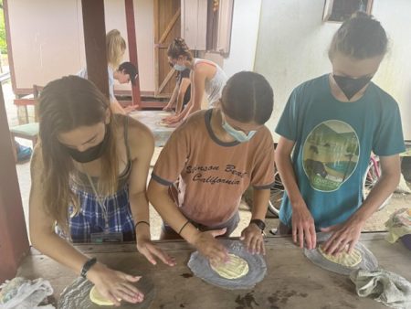 students making tortillas