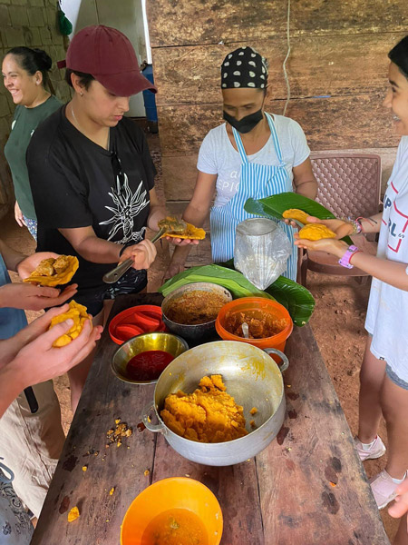 volunteers in panama making tamales