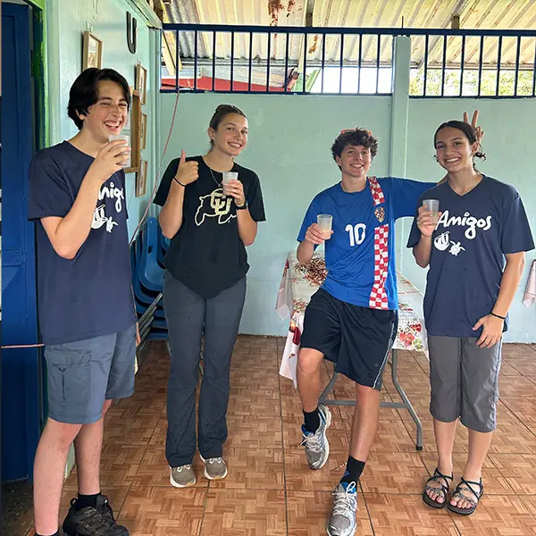 Group of smiling AMIGOS volunteers