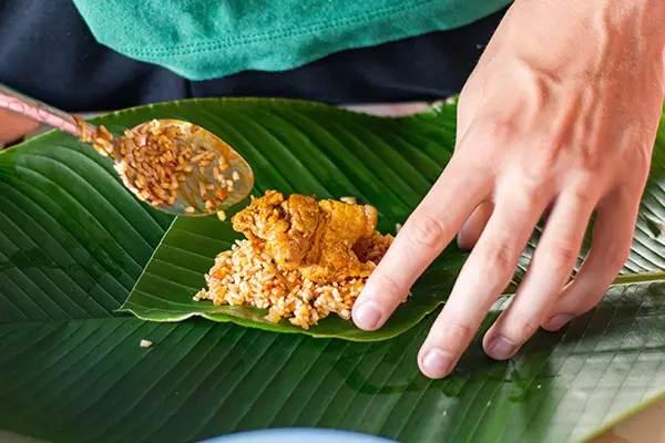 Rice and chicken ready to be wrapped as a Tamal