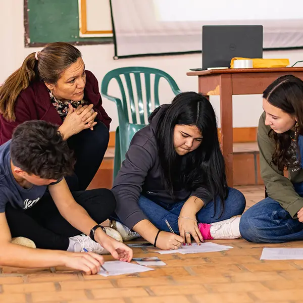 Volunteers and local youth during Briefing