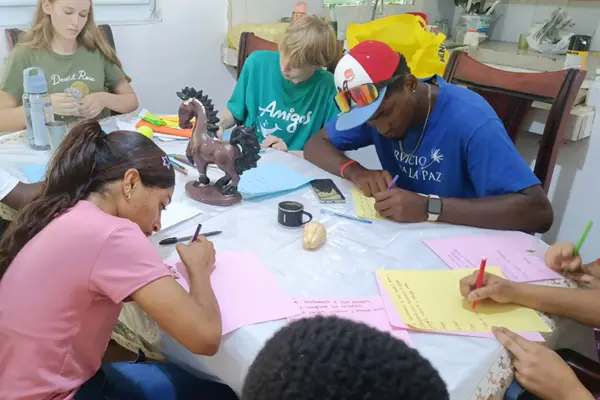 Volunteers and local youth during Briefing activities