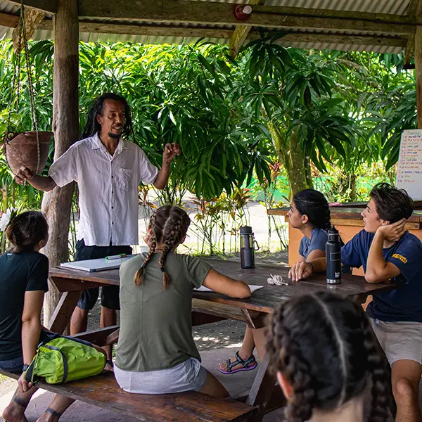 Volunteers learn from partner agency representative