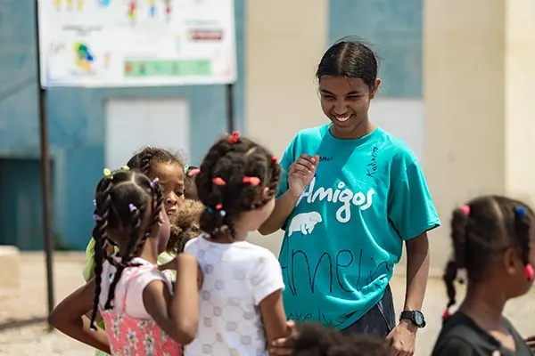 Volunteer leading activity with kids