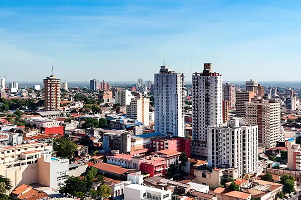 Aerial view of downtown Asunción showing high-rise buildings and surrounding city landscape