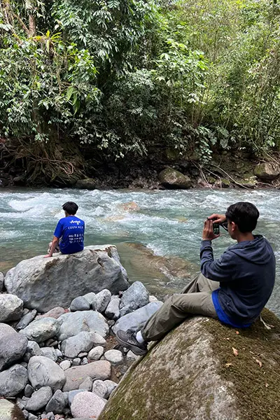 Volunteers enjoying a scenic nature break near a river