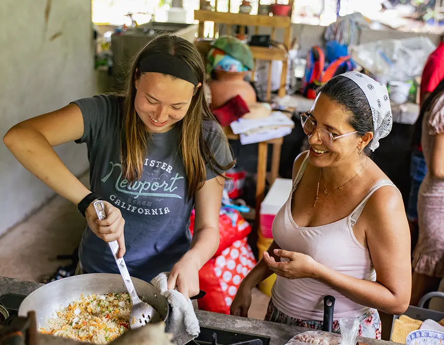 Volunteer and host mom cooking