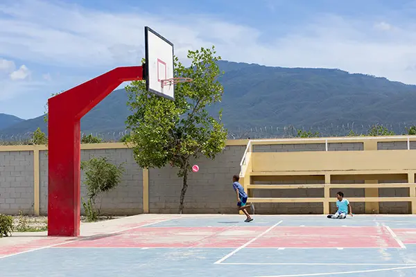 Community court with mountains in the background