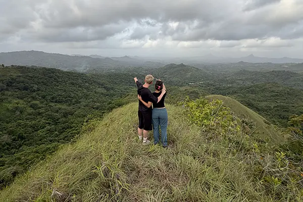 Volunteers looking at the landscape from a hill