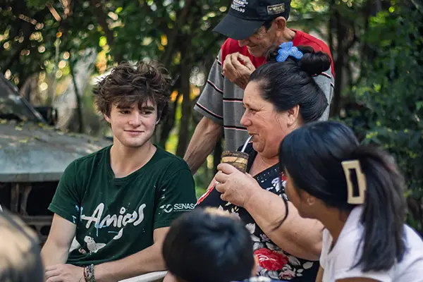 Volunteer with host mom drinking Terere