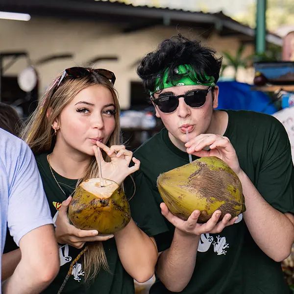 AMIGOS volunteers enjoying a fresh coconut