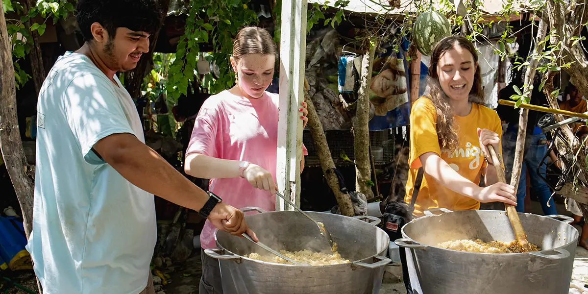 Volunteers cook local food
