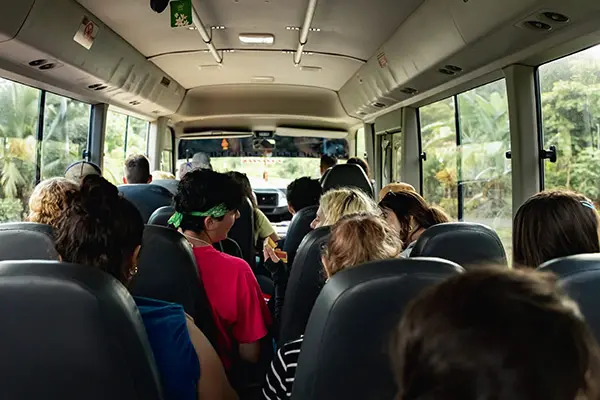 Volunteers riding inside a travel bus
